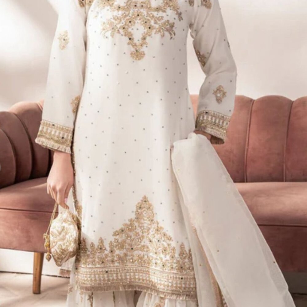 Beautiful women white sharara suit with heavy embroidary and pearl work